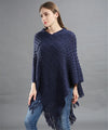 Poncho asymétrique à paillettes avec longues franges tricotées