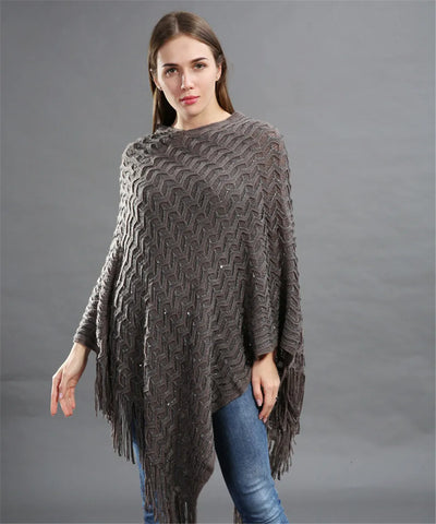 Poncho tricot asymétrique paillettes longues franges motif tressé texturé