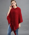Femme portant poncho paillettes tricot asymétrique longues franges casual chic